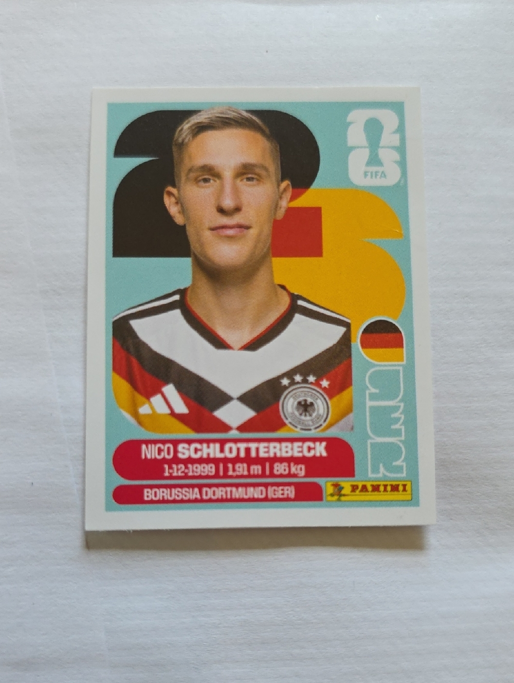 Panini Sticker - Teal, Yellow, Black, Red, White
